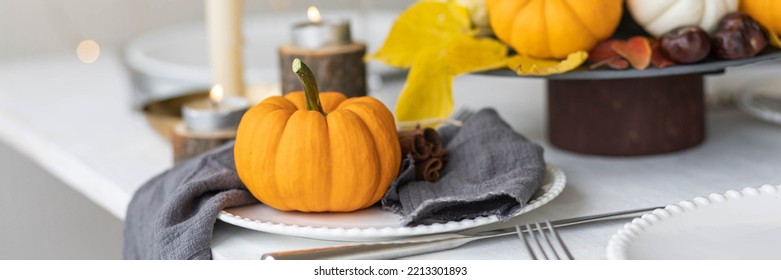 Idea For A Beautiful Autumn Setting For Thanksgiving Family Dinner Or Wedding. Orange Pumpkin As Decor. Cozy Fall Home Atmosphere. Banner Copy Space For Text