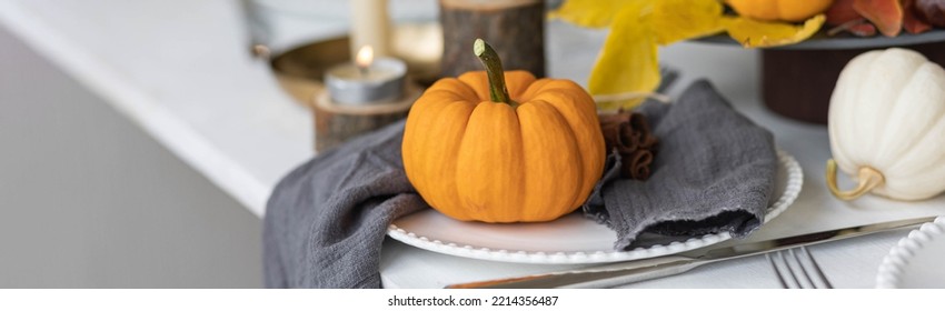 Idea For A Beautiful Autumn Setting For Thanksgiving Family Dinner Or Wedding. Orange Pumpkin As Decor. Cozy Fall Home Atmosphere. Banner Copy Space For Text