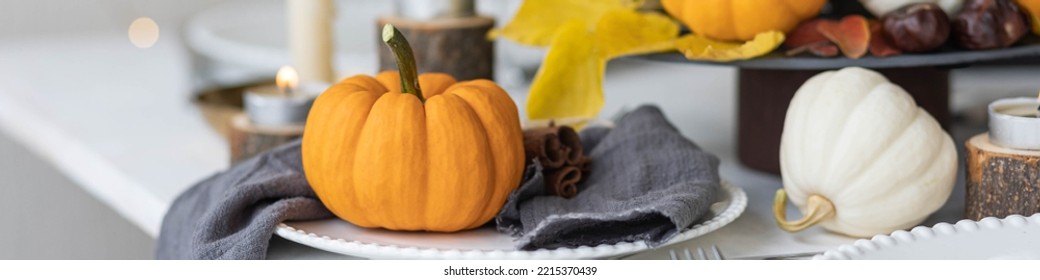 Idea For A Beautiful Autumn Setting For Thanksgiving Family Dinner Or Wedding. Orange Pumpkin As Decor. Cozy Fall Home Atmosphere. Banner Copy Space For Text