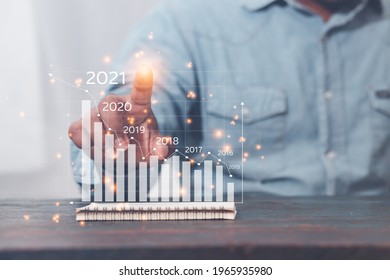 Idea Business Plan 2021 Businessmen With A Record Document Showing The Operational Plan, Analysis Of Business Strategies For The Year 2021.
