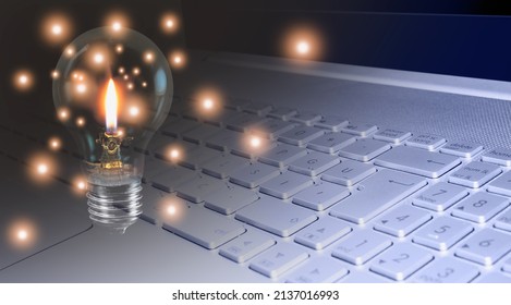 Idea concepts - Computer notebook or laptop with light bulb