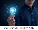 Idea innovation and inspiration concept.Hand of man holding illuminated light bulb, Idea innovation and inspiration concept.  creativity with bulbs that shine glitter, Concept for success.