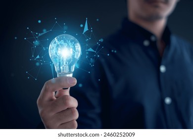 Idea innovation and inspiration concept.Hand of man holding illuminated light bulb, Idea innovation and inspiration concept.  creativity with bulbs that shine glitter, Concept for success.