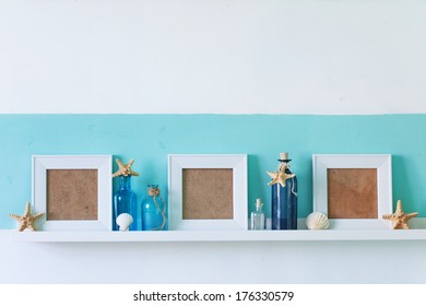 Idea of interior decoration with starfishes, glass bottles and wooden elements
