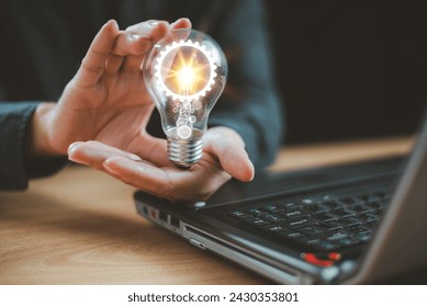 Idea knowledge, education solution concept. Innovative digital technology. Brainstorm creativity, idea thinking. Businessman use computer with light bulb icon. Inspiration for sustainable business