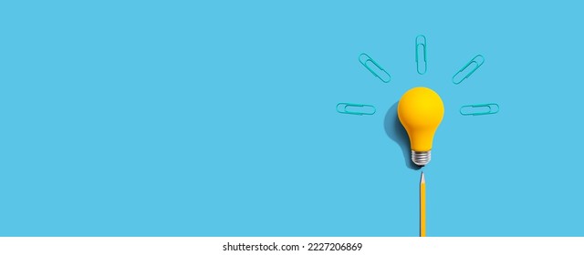 Idea light bulb with clips - flat lay