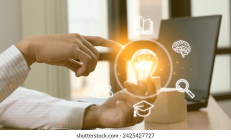 Idea light bulb moment Man with light bulb floating above his hand It represents a time of creative inspiration. Businessman holding light bulbs the idea of ​​inspiration from online 