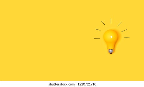 Idea light bulb on a vivid yellow background