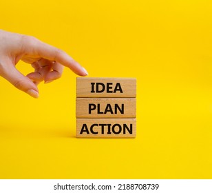 Idea Plan Action Symbol. Wooden Blocks With Words Idea Plan Action. Beautiful Yellow Background. Businessman Hand. Business And Idea Plan Action Concept. Copy Space.