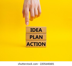 Idea Plan Action Symbol. Wooden Blocks With Words Idea Plan Action. Beautiful Yellow Background. Businessman Hand. Business And Idea Plan Action Concept. Copy Space.