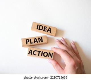 Idea Plan Action Symbol. Wooden Blocks With Words Idea Plan Action. Beautiful White Background. Businessman Hand. Business And Idea Plan Action Concept. Copy Space.