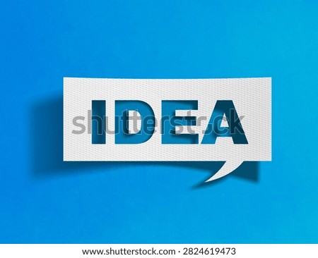 Idea speech bubble on blue background with paper cutout design