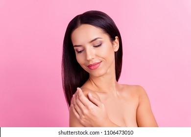 Ideal charming model with  touching naked shoulders with hand, enjoying her ideal skin after shower, isolated over pink background - Shutterstock ID 1106473010