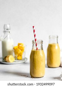 Ideal For A Healthy Snack Or Breakfast Delicious, Velvety Vegan Golden Mango Smoothie Made Of Mango, Almod Butter, Almond Milk, Ginger And Banana. 