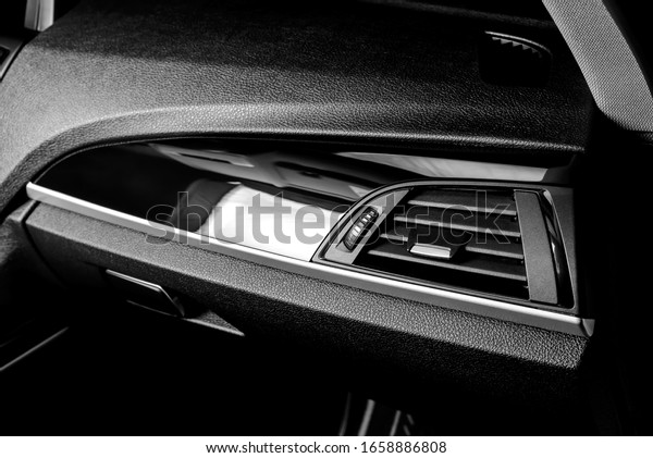 The ideal surface of plastic in the interior of the
car is black after polishing and cleaning with car chemistry. Black
and white photo