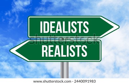 Idealists or realists road sign on sky background