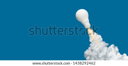 Ideas inspiration concepts with rocket lightbulb on blue background.Business start up or goal to success. creativity of human