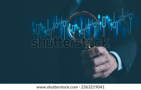 Ideas and perspectives, Stock investment stock market for analysis technical graph Businessman hand holding magnifying glass with virtual stock market chart, Business investment earning income concept