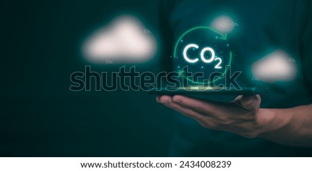 Ideas for reducing carbon emissions or using carbon credits for organizations. Businessman showing carbon credit and green business environmental conservation sustainable environmental development
