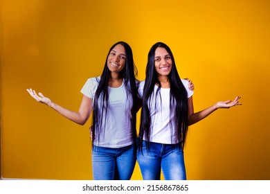 Identical Twin Sisters Pointing To Free Space For Text