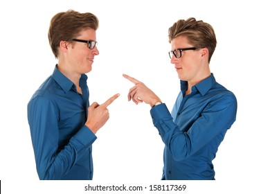 Identically Adult Male Twins Pointing To Each Other In Studio