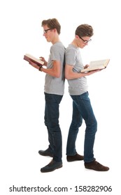 Identically Adult Male Twins Standing And Reading Books