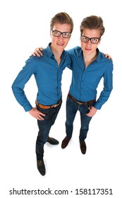 Identically Adult Male Twins In Studio