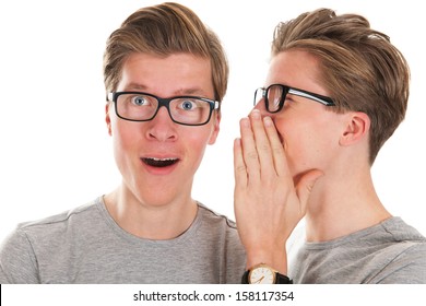 Identically Adult Male Twins Whispering In Ear Isolated Over White Background