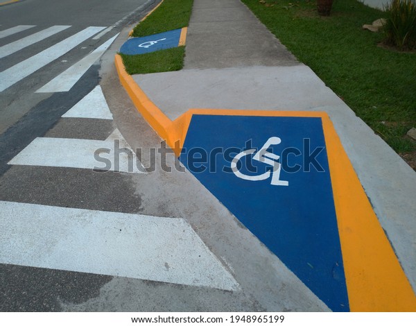 identification\
wheelchair access ramp and\
crosswalk.