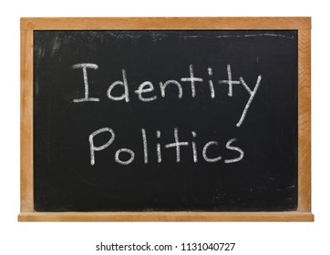 Identity Politics Written In White Chalk On A Black Chalkboard Isolated On White