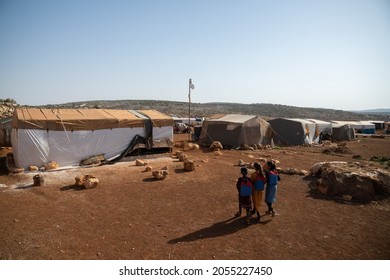 IDLIB, SYRIA - OCTOBER 9, 2021: Children Attend The First Day Of School In A Refugees Camp In The Countryside Of Idlib