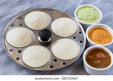 Idlis Sambar  And Chutneys On Idli Maker, Selective Focus