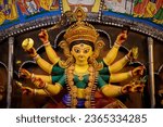 Idol of Goddess Devi Durga at a decorated puja pandal in Kolkata, West Bengal, India. Durga Puja is a famous and major religious festival of Hinduism that is celebrated throughout the world.