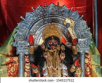 Idol of Goddess Kali in a pandal, during Kali puja in Kolkata. Photo taken inside a pandal (fabricated structure, mostly temporary). Kali is a Hindu Goddess.