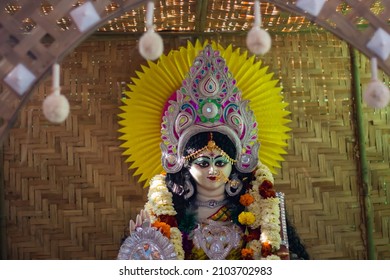 idol of hindu goddess saraswati being worshipped during saraswati puja festival in bengal. daytime closeup shot.