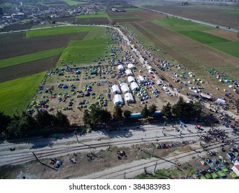 Idomeni, Greece - March 1, 2016: Thousands of immigrants are in a wait at the border between Greece and FYROM waiting to cross the borders to FYR of Macedonia. Aerial shot with drone - Shutterstock ID 384383983