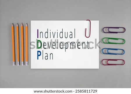 IDP Individual Development Plan. Concept for startup, small business, entrepreneurship, innovation, development, planning, success. Business Acronym text on white paper on desktop with stationery. 