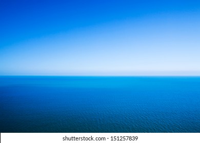 Idyllic Abstract Background - Horizon Line Between Calm Sea And Clear Blue Sky