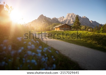 Idyllic alpine hut in front of a beautiful mountain backdrop, Austria