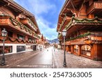 Idyllic Alpine village of Gstaad street view, luxury winter destination in Switzerland