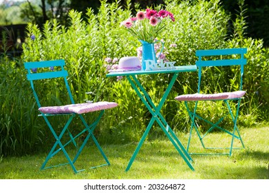 Idyllic Garden With Table And Chair