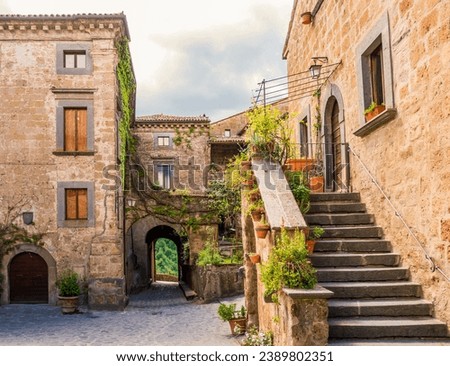 Idyllic inner alley of Civita di Bagnoregio, ghost mediaeval town built above a plateau of friable volcanic tuff, Lazio, central Italy
