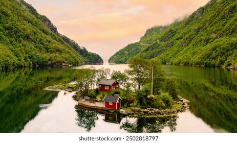 Idyllic island retreat in Norway stunning fjords, surrounded by lush landscapes and tranquil waters perfect for relaxation and exploration, red cabin at an Island in Lovrafjorden - Powered by Shutterstock