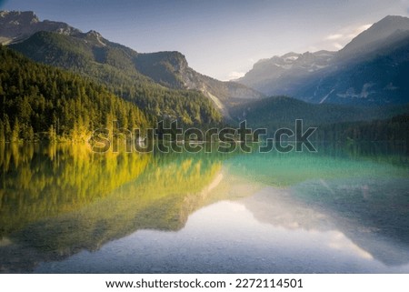 Idyllic Lake Tovel reflection symmetry in Trentino-Alto Adige, Italy