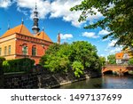 Idyllic landscape of The Raduni Canal in The Old Town in Gdansk with famous medieval landmarks: old City Hall, bridge of love and Millers