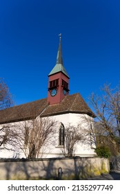 Idyllic protestant church at Laufen-Uhwiesen on a sunny spring day. Photo taken March 5th, 2022, Laufen-Uhwiesen, Switzerland.