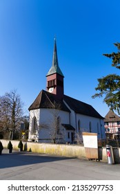Idyllic protestant church at Laufen-Uhwiesen on a sunny spring day. Photo taken March 5th, 2022, Laufen-Uhwiesen, Switzerland.