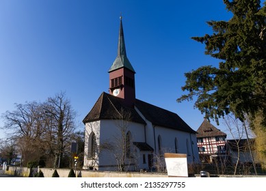 Idyllic protestant church at Laufen-Uhwiesen on a sunny spring day. Photo taken March 5th, 2022, Laufen-Uhwiesen, Switzerland.