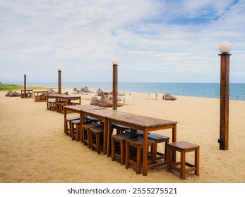 idyllic Summer Thon beachfront cafe,restaurant dining scene at Ban Thon beach,Narathiwat,Thailand - Powered by Shutterstock