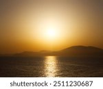 Idyllic sunset over aegean sea. View from Hydra island, Saronic Gulf. Greece. 